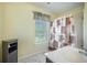 Light filled bathroom with decorative shower curtain, marble floors, grey vanity and a window that allows natural light at 529 Beverly Dr, Summerville, SC 29485