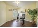 Bedroom with wooden floor features a workstation, ceiling fan and a window allowing natural light at 529 Beverly Dr, Summerville, SC 29485