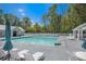 Community swimming pool features a clean and inviting space with ample seating and shaded areas for resident enjoyment at 529 Beverly Dr, Summerville, SC 29485