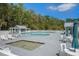 A community pool features a hot tub, lounge seating, and a shaded pavilion with tables, creating a resort-like atmosphere at 529 Beverly Dr, Summerville, SC 29485