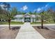 Community clubhouse entrance with palm trees offering residents a welcoming gathering place for meetings and events at 529 Beverly Dr, Summerville, SC 29485
