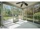 Enclosed patio featuring an outdoor kitchen, ceiling fan, and overlooking the beautiful landscaped backyard at 529 Beverly Dr, Summerville, SC 29485