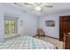A sunny bedroom with large window, window seat, and comfy chair next to a wooden dresser at 643 Edmonds Dr, Charleston, SC 29412