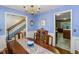 Lovely dining room with blue walls, wainscoting, and a vintage table with seating for six at 643 Edmonds Dr, Charleston, SC 29412