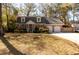 Charming brick home with a welcoming front porch, dormer windows, mature trees and a two-car attached garage at 643 Edmonds Dr, Charleston, SC 29412