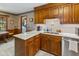 Classic kitchen with wooden cabinets, granite countertops, stainless steel sink, and modern appliances at 643 Edmonds Dr, Charleston, SC 29412