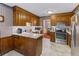 Traditional kitchen with wooden cabinets, light countertops, stainless steel appliances, and tile flooring at 643 Edmonds Dr, Charleston, SC 29412