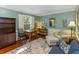 Bright living room with hardwood floors, accent rug, built-in bookshelves, and plenty of natural light at 643 Edmonds Dr, Charleston, SC 29412