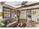Comfortable living room featuring a ceiling fan, neutral walls, and access to the patio at 643 Edmonds Dr, Charleston, SC 29412