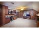 A paneled office with custom built-ins, a ceiling fan, and a large window at 643 Edmonds Dr, Charleston, SC 29412