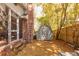 Backyard featuring a storage shed, mature trees, and access to the side of the house at 643 Edmonds Dr, Charleston, SC 29412