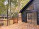 Wooden back deck featuring a sliding glass door and backyard views at 6464 St Anthony Dr, Hollywood, SC 29449