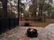 Cozy backyard featuring a stone patio and fire pit perfect for relaxing at 6464 St Anthony Dr, Hollywood, SC 29449