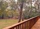 Wooden back deck railing overlooking backyard at 6464 St Anthony Dr, Hollywood, SC 29449