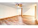 Finished basement with wood-look floors and neutral walls, accented by wood trim at 6464 St Anthony Dr, Hollywood, SC 29449