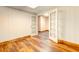 Finished basement area featuring a light interior, wood-look flooring, and bright french doors at 6464 St Anthony Dr, Hollywood, SC 29449