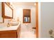 Updated bathroom featuring a stone vessel sink, wood cabinets, and walk-in shower at 6464 St Anthony Dr, Hollywood, SC 29449