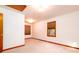 Bright bedroom featuring plush carpeting, natural wood trim, and windows providing ample sunlight at 6464 St Anthony Dr, Hollywood, SC 29449