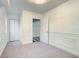 Bright bedroom with carpet, crisp white trim, and a view into other rooms at 6464 St Anthony Dr, Hollywood, SC 29449