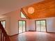 Bright living room with wood ceiling, tile floors, and sliding glass doors leading to the outside at 6464 St Anthony Dr, Hollywood, SC 29449