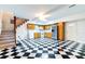 The living room features checkerboard floors, light wood cabinets, and a charming staircase at 6464 St Anthony Dr, Hollywood, SC 29449