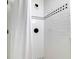 Bright and clean shower with white subway tile and black accent tiles and fixtures at 6464 St Anthony Dr, Hollywood, SC 29449