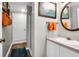 Bathroom with vanity, mirror, towels, and shower behind glass wall at 683 Edmonds Dr, Charleston, SC 29412