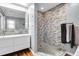 Elegant bathroom with double sinks, a large mirror, and a tiled walk-in shower for a luxurious feel at 683 Edmonds Dr, Charleston, SC 29412
