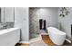Modern bathroom with stylish vanity, frameless glass shower, and standalone tub for a spa-like experience at 683 Edmonds Dr, Charleston, SC 29412