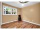 An empty bedroom with hardwood floors and a window with view to the outside at 683 Edmonds Dr, Charleston, SC 29412