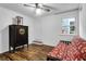 A bedroom with hardwood floors and a futon, with view to a window and door at 683 Edmonds Dr, Charleston, SC 29412