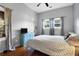 Cozy bedroom with a comfortable bed, bright blue dresser, and sunny windows offering natural light at 683 Edmonds Dr, Charleston, SC 29412