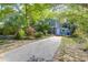Two-story home showcasing a driveway and landscaping at 683 Edmonds Dr, Charleston, SC 29412