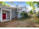 Charming home with inviting front porch with red front door at 683 Edmonds Dr, Charleston, SC 29412
