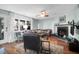 Cozy living room showcasing natural light, hardwood floors, and a fireplace at 683 Edmonds Dr, Charleston, SC 29412
