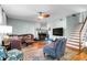 Comfortable living room featuring a fireplace, hardwood floors, and cozy furniture at 683 Edmonds Dr, Charleston, SC 29412