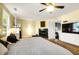 Main bedroom with fireplace and mounted TV, with a view to an ensuite office at 683 Edmonds Dr, Charleston, SC 29412
