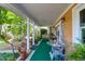 Relaxing side porch adorned with plants, creating a serene outdoor space at 683 Edmonds Dr, Charleston, SC 29412