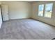 Empty bedroom with two windows, neutral paint, and carpeted flooring at 700 Pisces Ln, Summerville, SC 29486