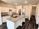 Spacious kitchen with a large island, granite countertops, and modern appliances at 700 Pisces Ln, Summerville, SC 29486