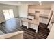 Beautiful kitchen featuring an island, granite countertops, stainless sink, and bright white cabinetry and dark wood laminate flooring at 700 Pisces Ln, Summerville, SC 29486