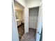 View of a bathroom with a shower and a closet with shelving, from the doorway at 707 Pisces Ln, Summerville, SC 29486