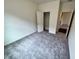An empty bedroom filled with natural light featuring plush carpeting and a closet at 707 Pisces Ln, Summerville, SC 29486
