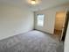 Bedroom featuring carpet and a window, with closet at 707 Pisces Ln, Summerville, SC 29486