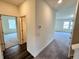 Hallway boasts luxury vinyl plank flooring, leading to spacious rooms filled with natural light at 707 Pisces Ln, Summerville, SC 29486