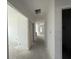 Hallway with white walls and trim leading to various rooms at 717 Blueway Ave, Summerville, SC 29486
