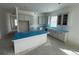 Kitchen featuring gray cabinets, an island with a white facade, and stainless steel appliances at 717 Blueway Ave, Summerville, SC 29486