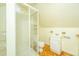 Cozy bathroom features a glass enclosed shower, toilet, and vanity with cabinet storage at 755 Jumbo Ln, Edisto Island, SC 29438