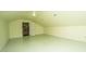 Spacious bonus room features a doorway to an enclosed closet and neutral light green paint at 755 Jumbo Ln, Edisto Island, SC 29438