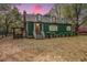 Exterior view of home with greenery and well-manicured lawn at 755 Jumbo Ln, Edisto Island, SC 29438